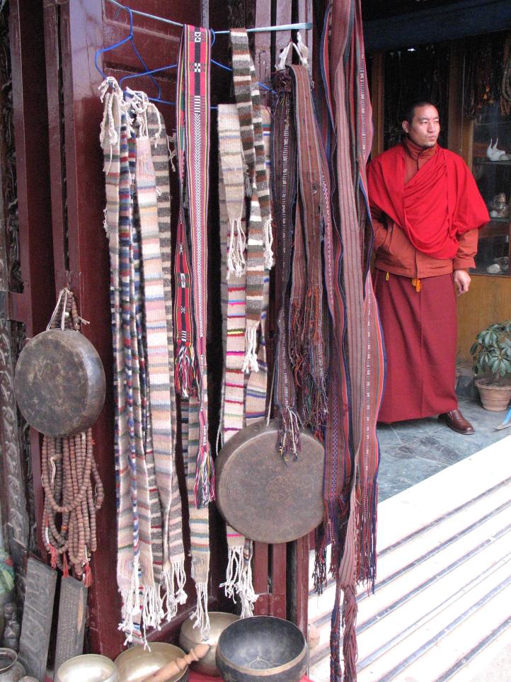 Monk in Katmandu selling Buddhist stuff